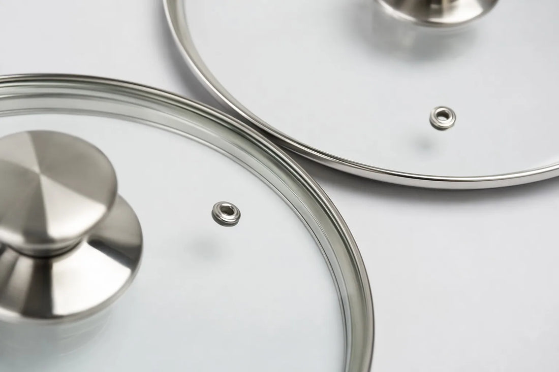 Close-up studio shot of C-series tempered glass cookware lids with polished stainless steel rim from a China glass lid manufacturer