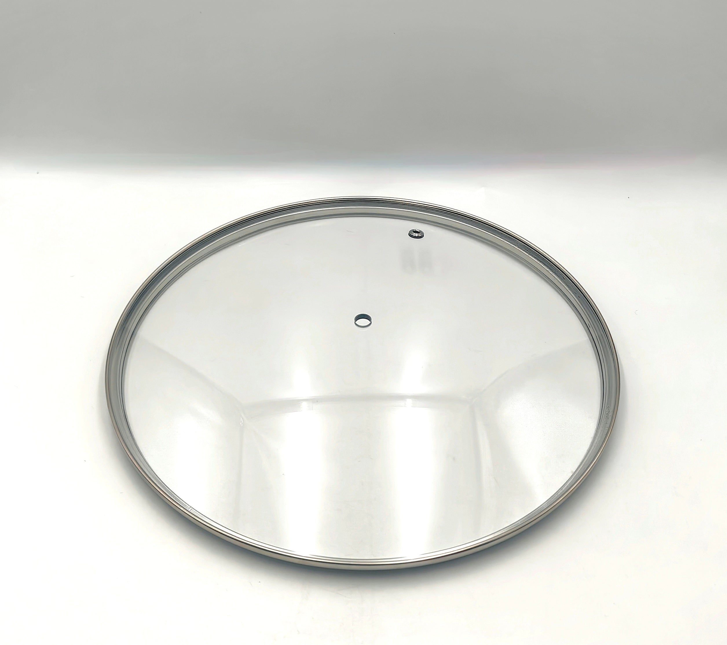 G28 - G-Series Narrow Rim Glass Lid (277–287mm) — angled detail view of stainless rim and glass dome
