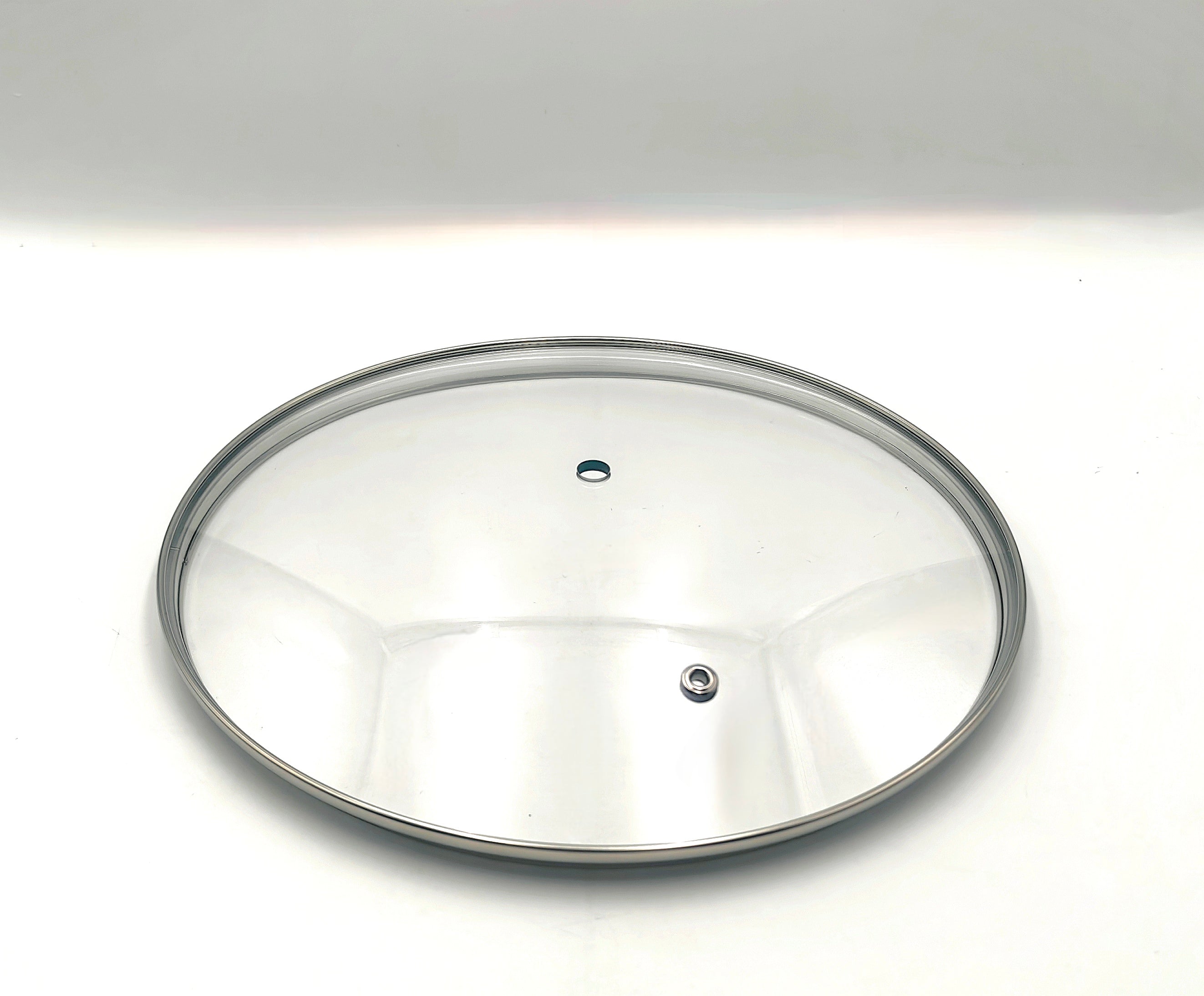 G24 - G-Series Narrow Rim Glass Lid (237–247mm) — angled detail view of stainless rim and glass dome